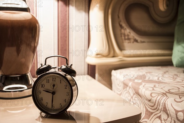 Alarm clock on bedside table