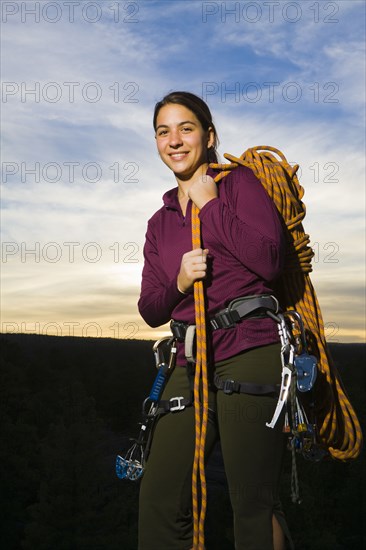 Caucasian woman preparing for rock climbing