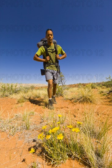 Black man hiking in desert