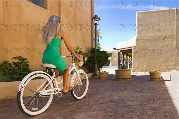 Caucasian woman riding bicycle