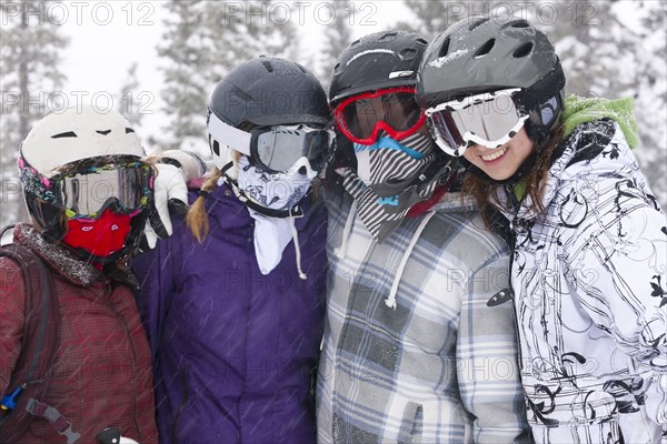 Skiers hugging in the snow