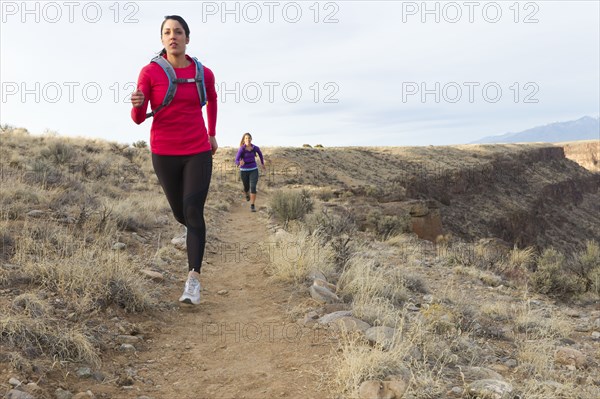 Hispanic runners training in remote area