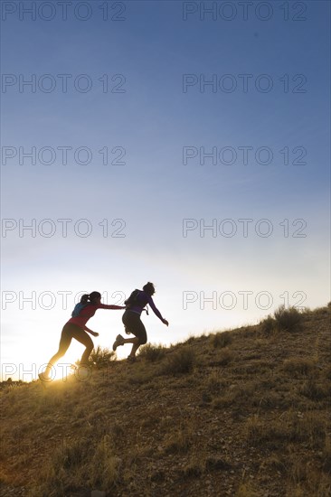 Hispanic runners training in remote area