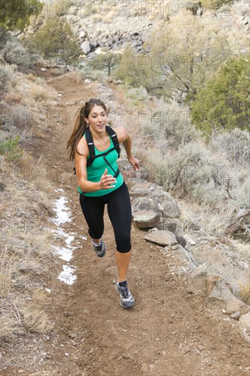 Hispanic runner training in remote area