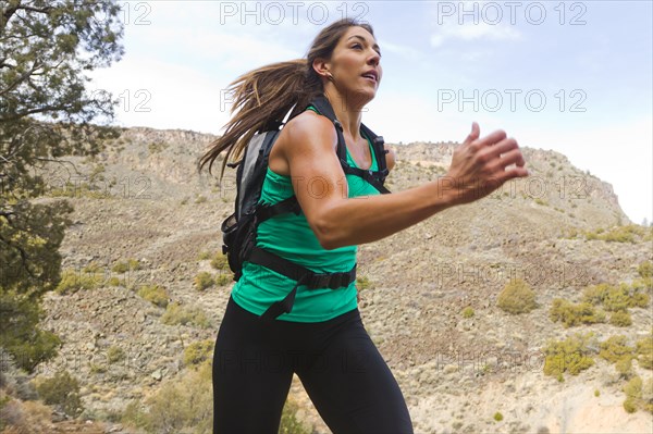 Hispanic runner training in remote area