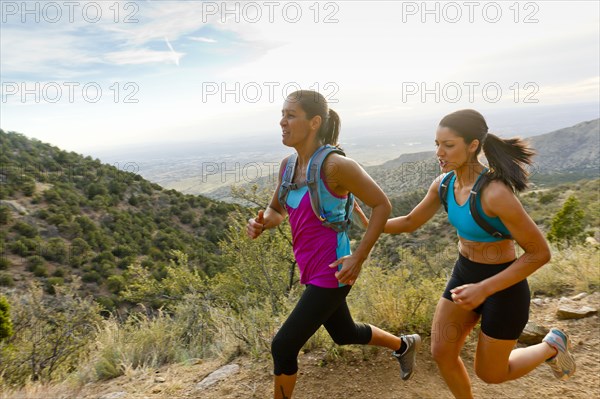 Hispanic women running in remote area