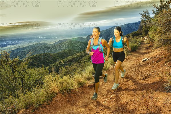 Hispanic women running in remote area