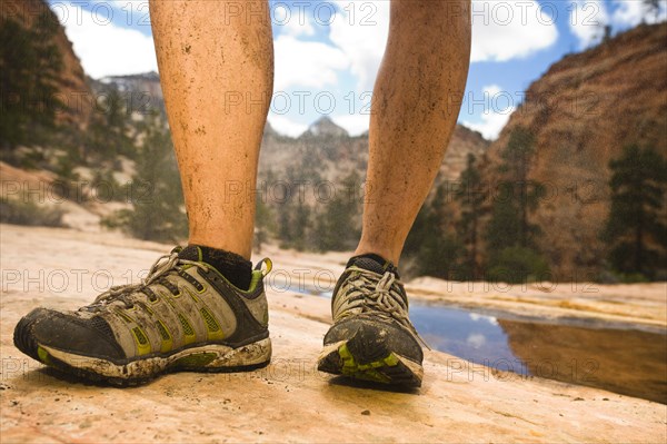 Caucasian woman's dirty calf's in canyon