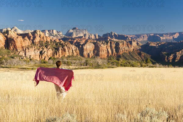 Caucasian woman standing in remote field