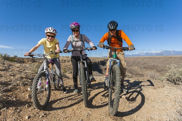 Family sitting on mountain bikes