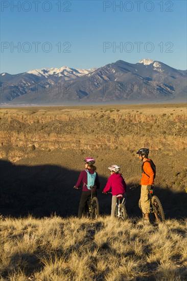 Family mountain biking together