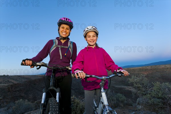 Sisters mountain biking together