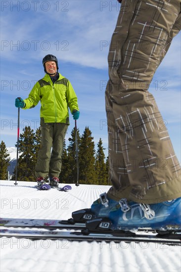 Caucasian couple skiing together