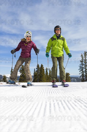 Caucasian couple skiing together