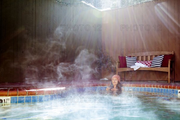 Woman relaxing in hot tub