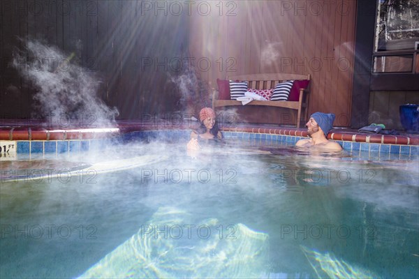 Couple relaxing in hot tub