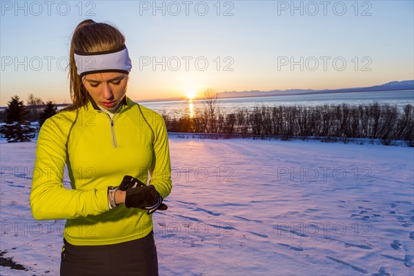 Caucasian runner checking the time on wristwatch