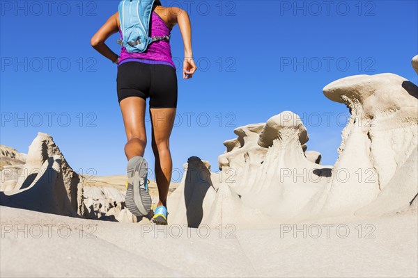 Native American woman running in desert