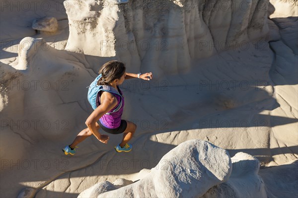 Native American woman running in desert