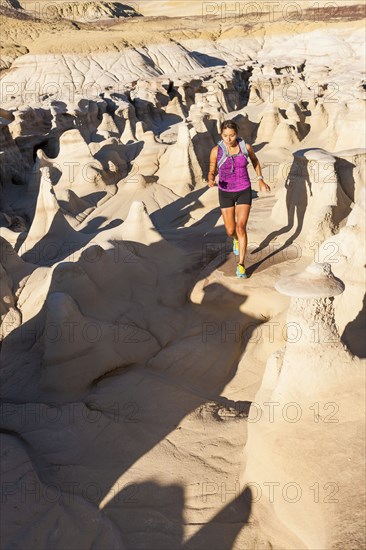 Native American woman running in desert