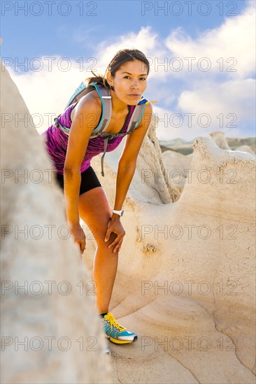 Native American woman resting in desert