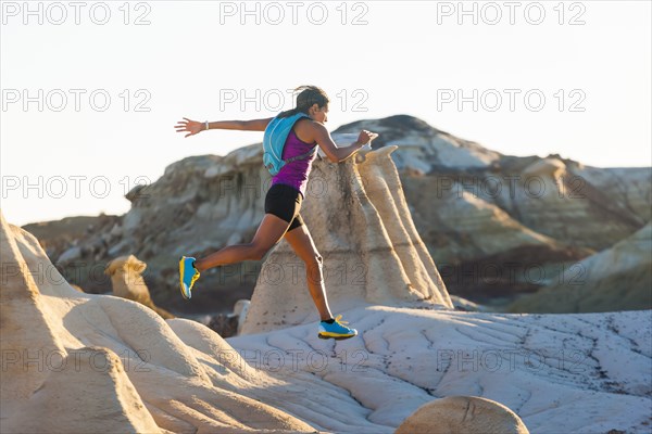 Native American woman running in desert