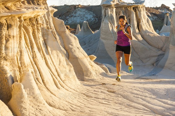 Native American woman running in desert