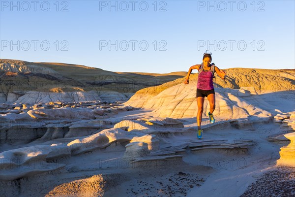 Native American woman running in desert