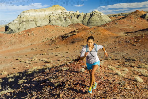 Native American woman running in desert