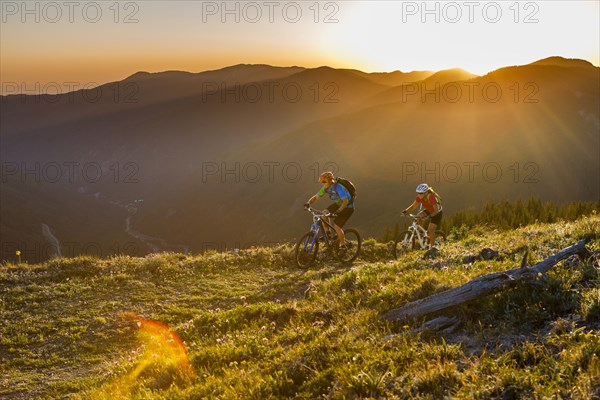 Caucasian couple mountain biking