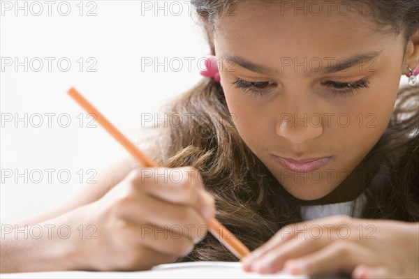 Mixed race girl doing homework