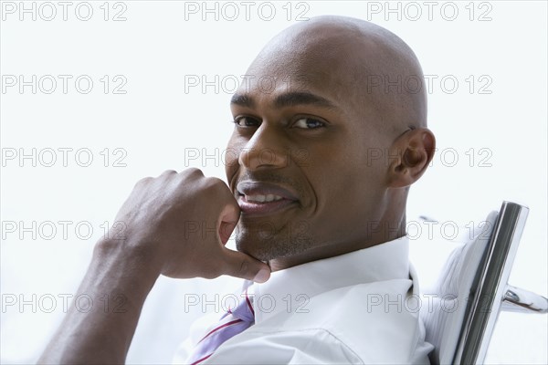 Mixed race businessman smiling