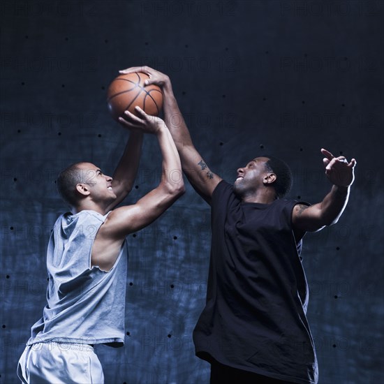 Men playing basketball