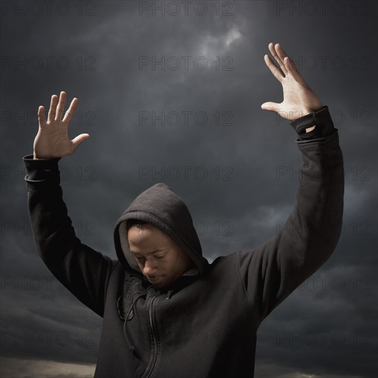 African man with arms raised