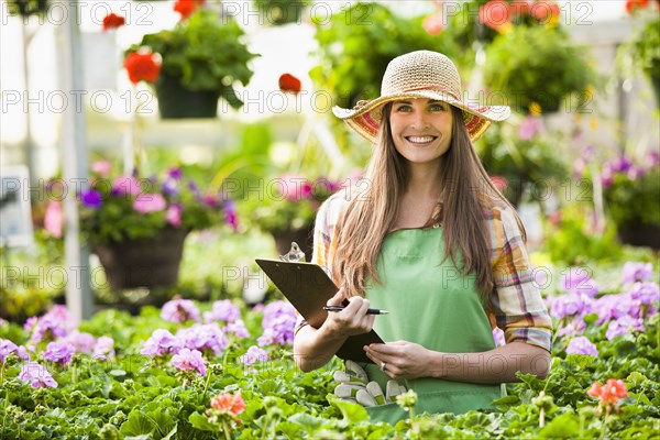 Caucasian woman working in plant nursery