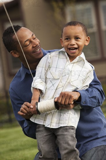 Father and son flying kite