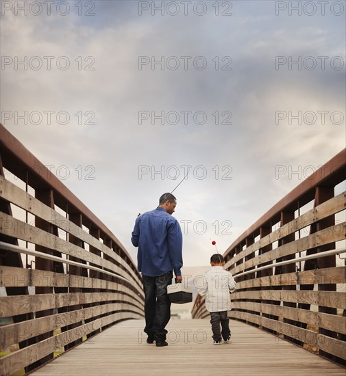 Father and son going fishing together