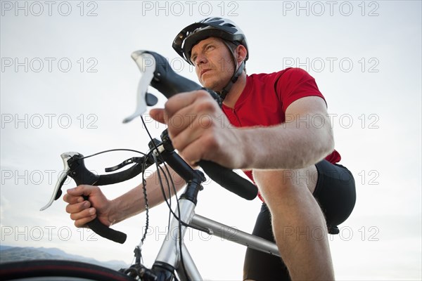 Caucasian man riding bicycle