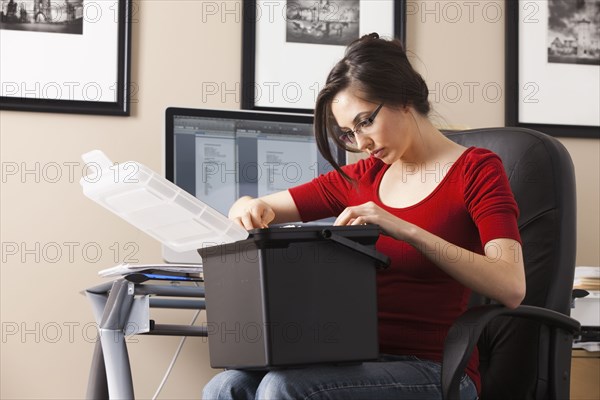 Caucasian woman working at desk in home office