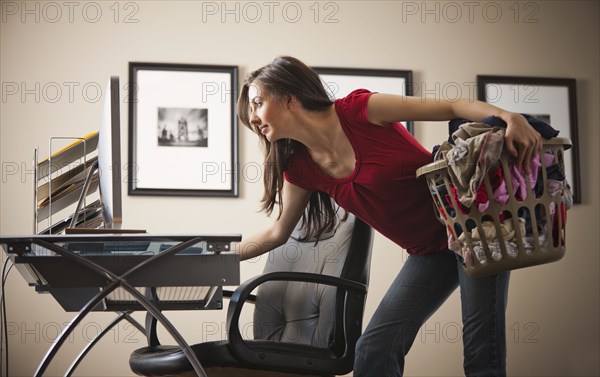 Caucasian woman multi-tasking home office