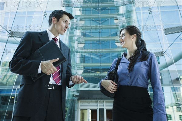 Caucasian business people talking together outdoors