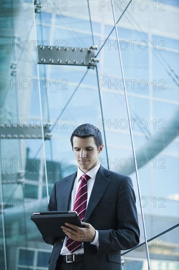 Caucasian businessman using digital tablet