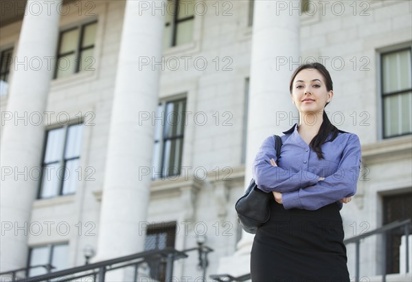 Caucasian businesswoman standing outdoors