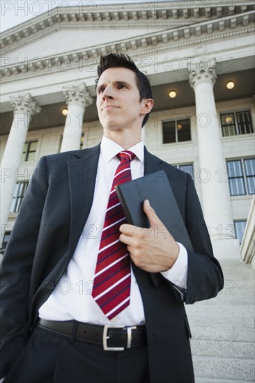 Caucasian businessman standing outdoors