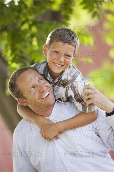 Playful Caucasian father and son