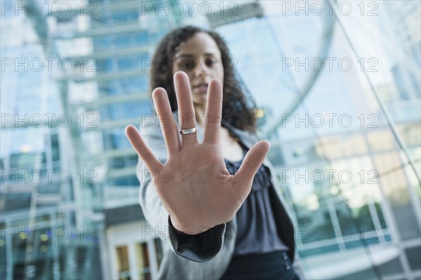 Caucasian businesswoman holding out hand