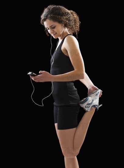 Caucasian woman stretching before exercise