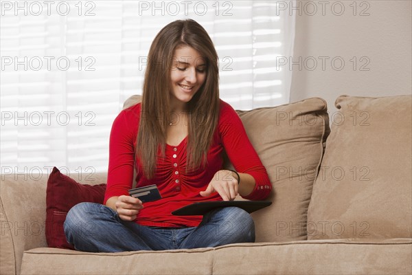 Caucasian woman shopping online using digital tablet