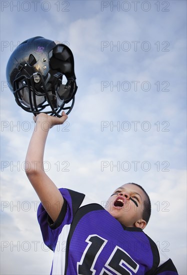 Cheering mixed race football player