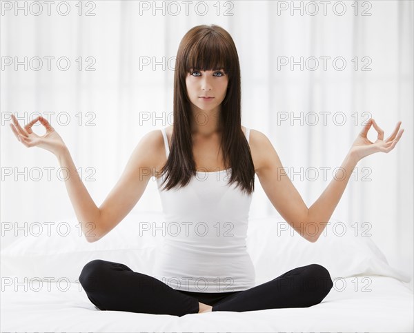 Caucasian woman practicing yoga